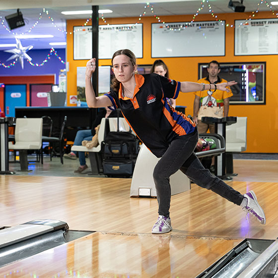 Lady participating in competitive bowling at Sunset Superbowl