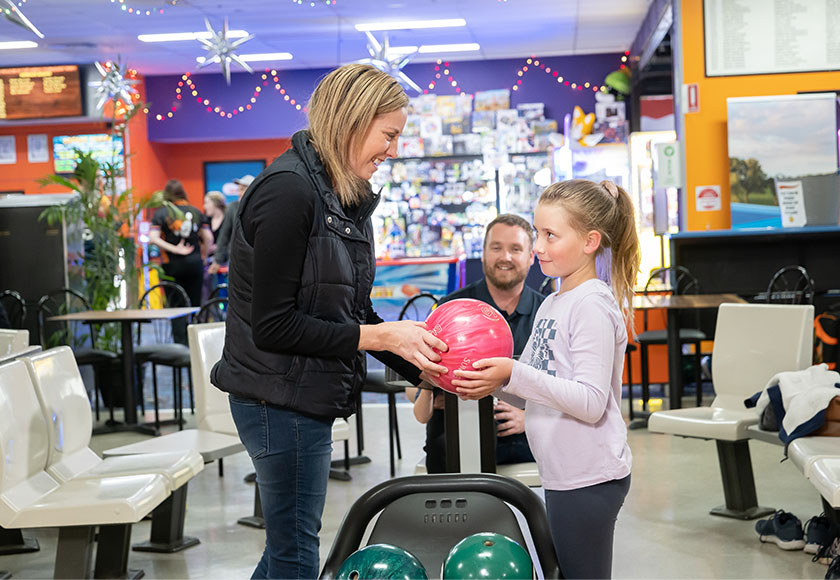 Mother and daughter bowling at Sunset Superbowl