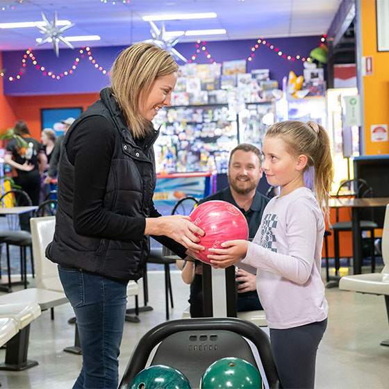 Mother and daughter bowling at Sunset Superbowl